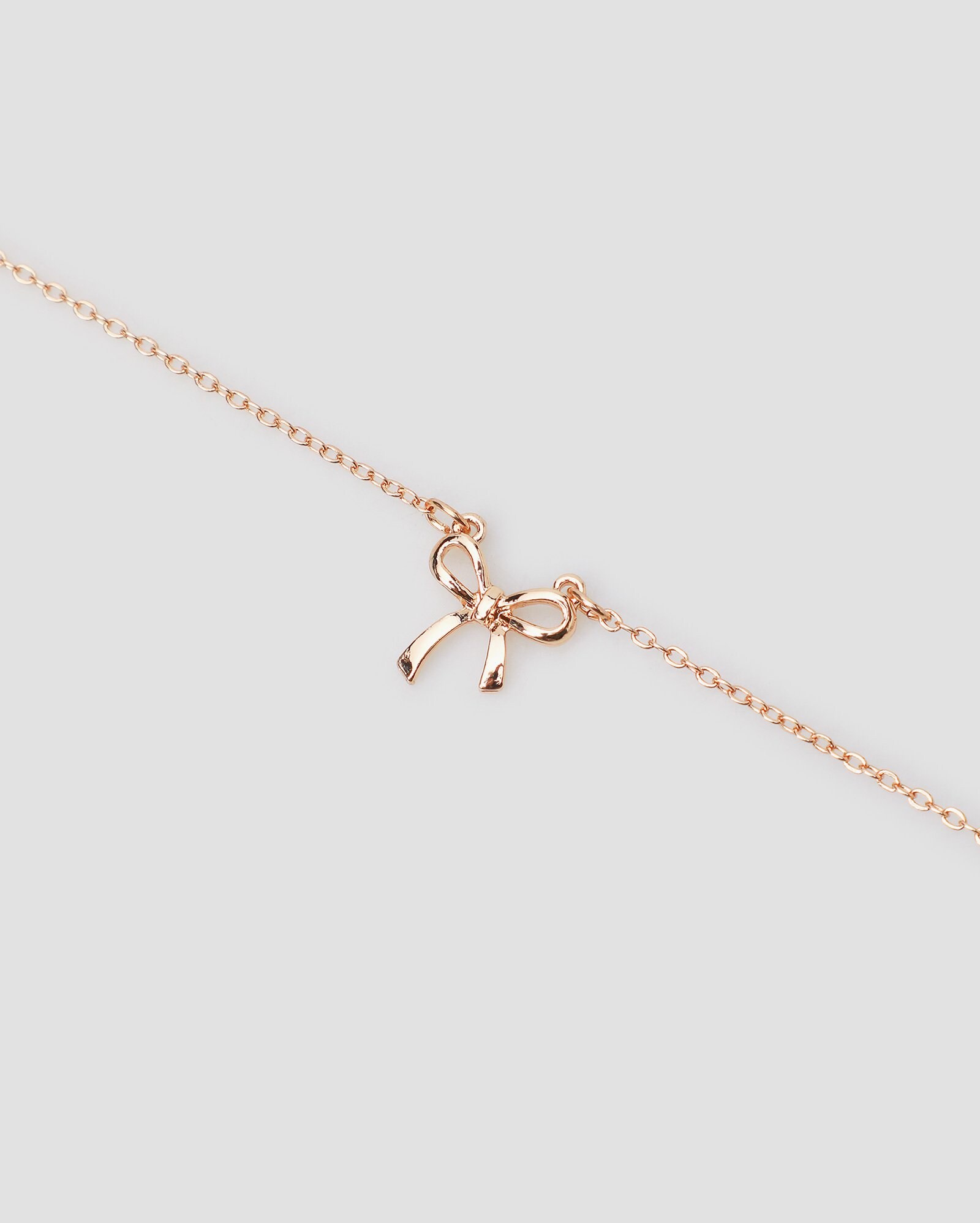 Colares Riachuelo Riachuelo | Colar feminino pingente laço dourado | Accessori by Riachuelo