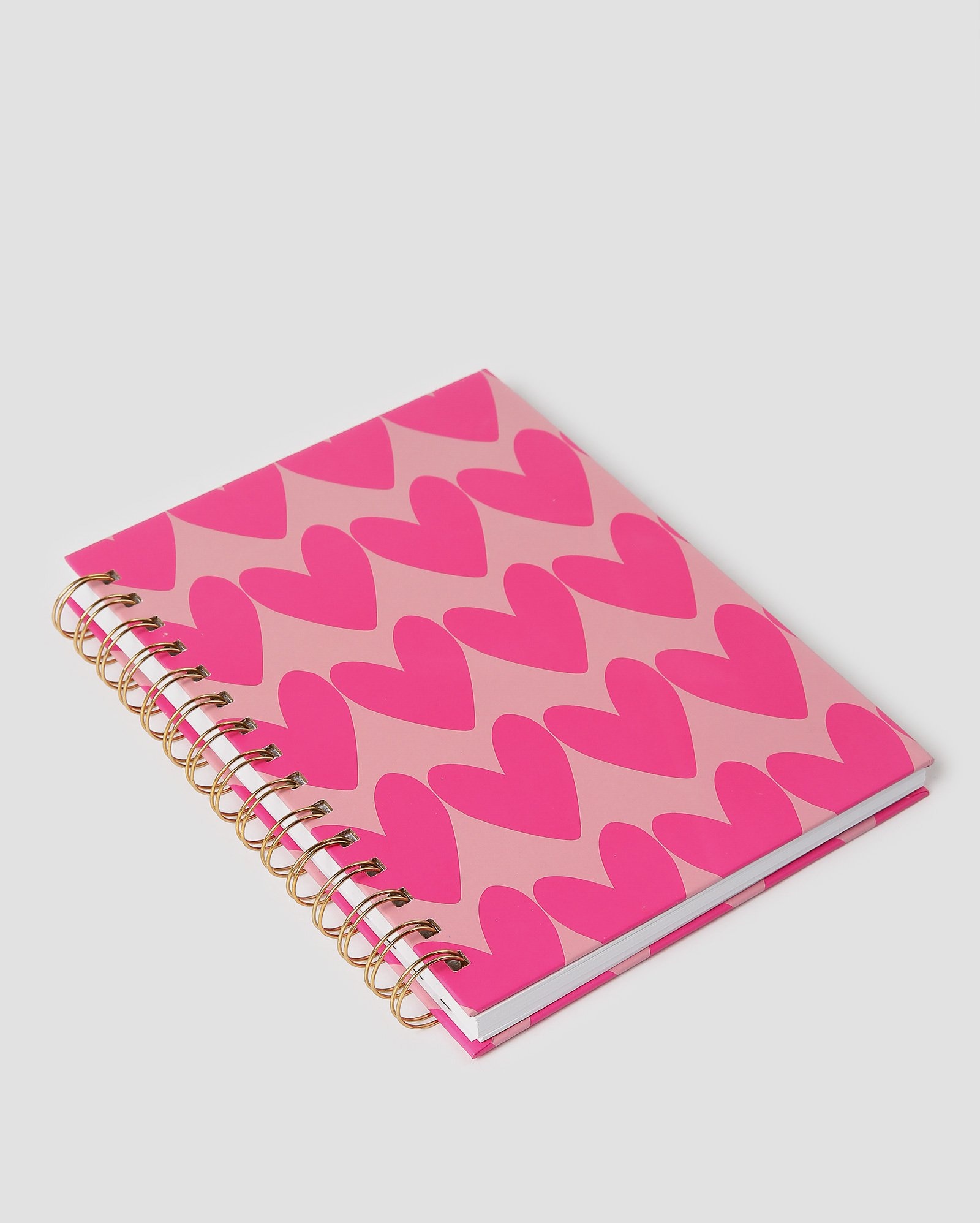 Caderno de anotações espiral com pauta corações rosa | Accessori by Riachuelo