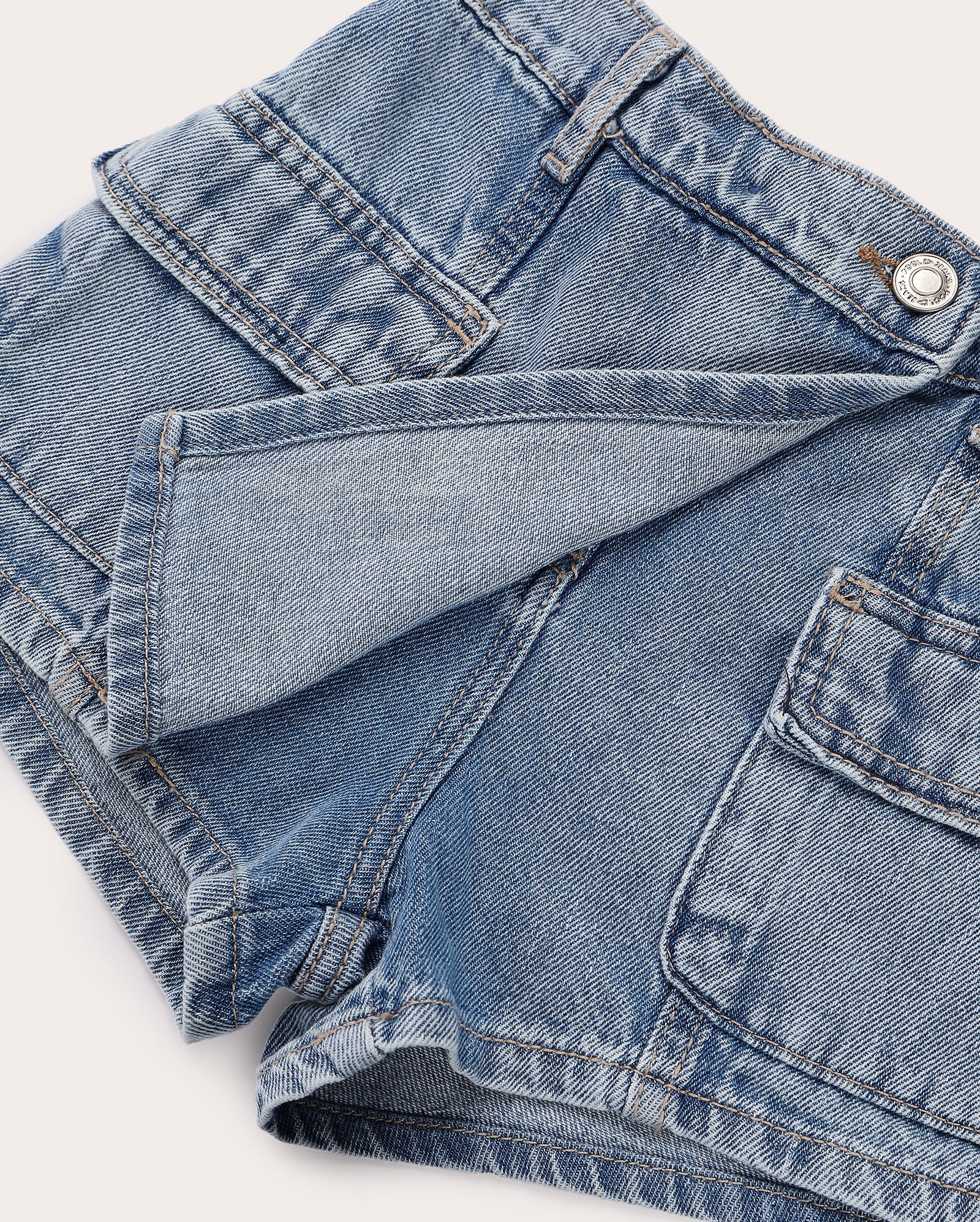 Short-saia jeans infantil cargo transpassado 4-10A denim médio