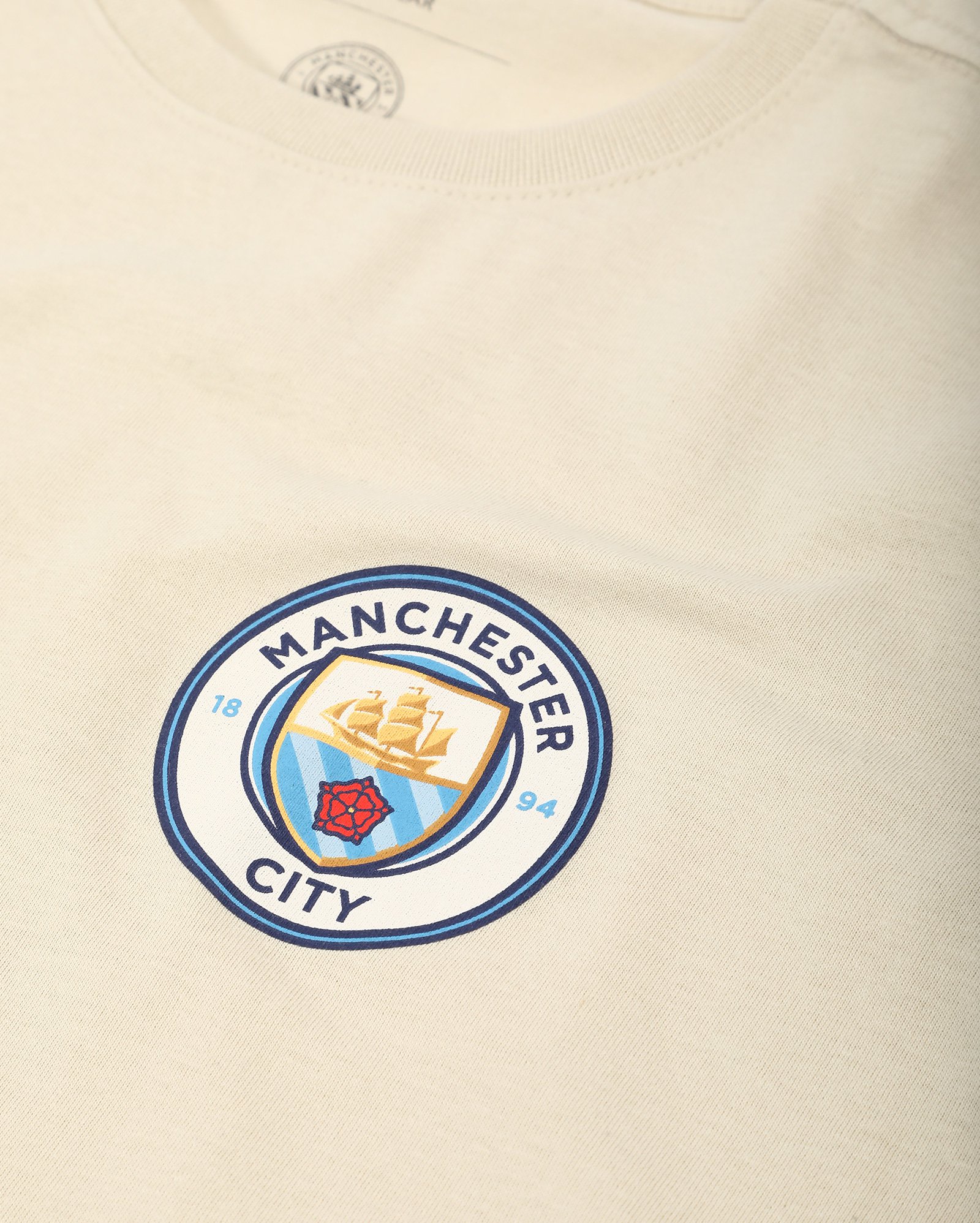 Camiseta juvenil futebol Manchester City cityzen bege