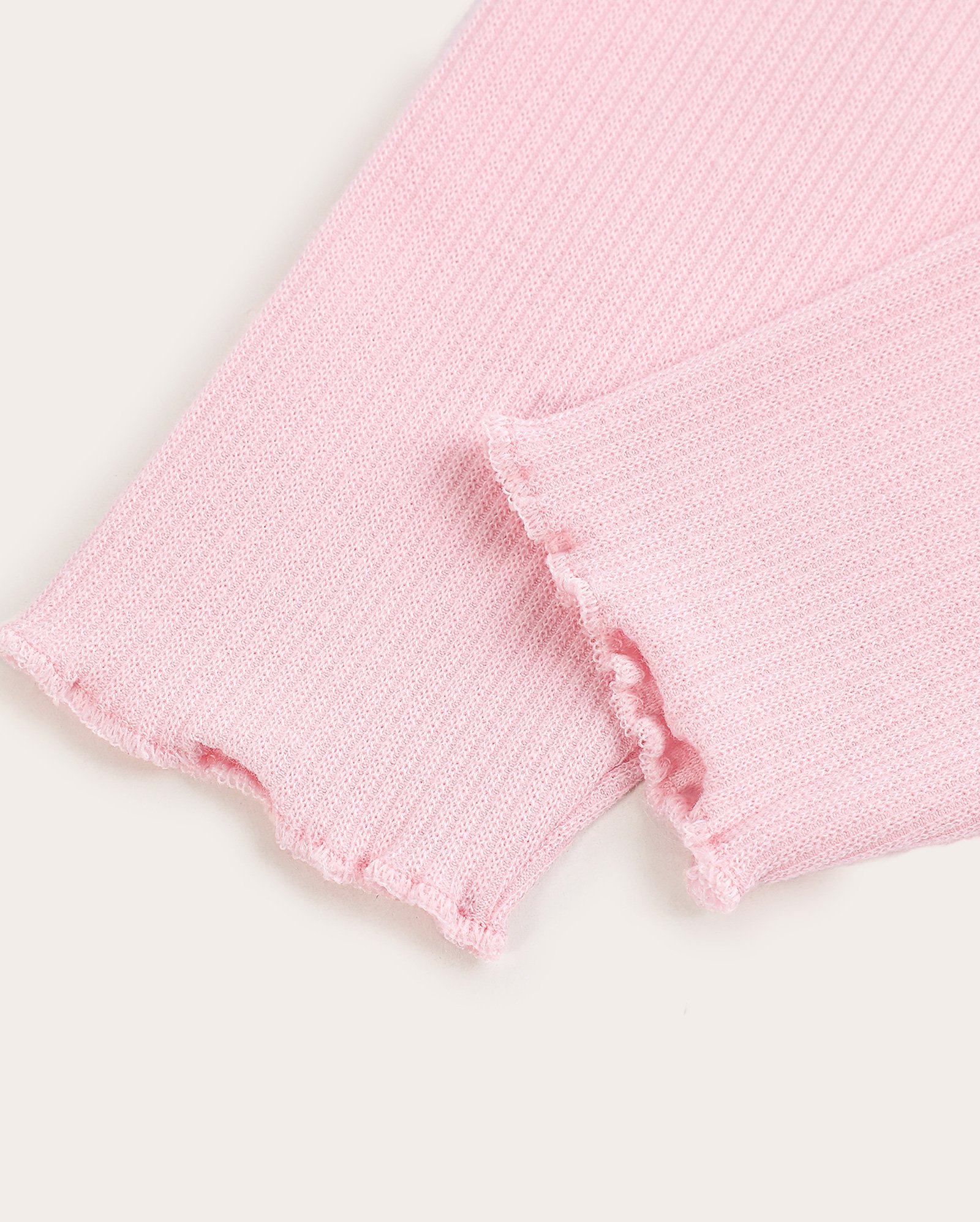Calça legging bebê canelada com babado rosa