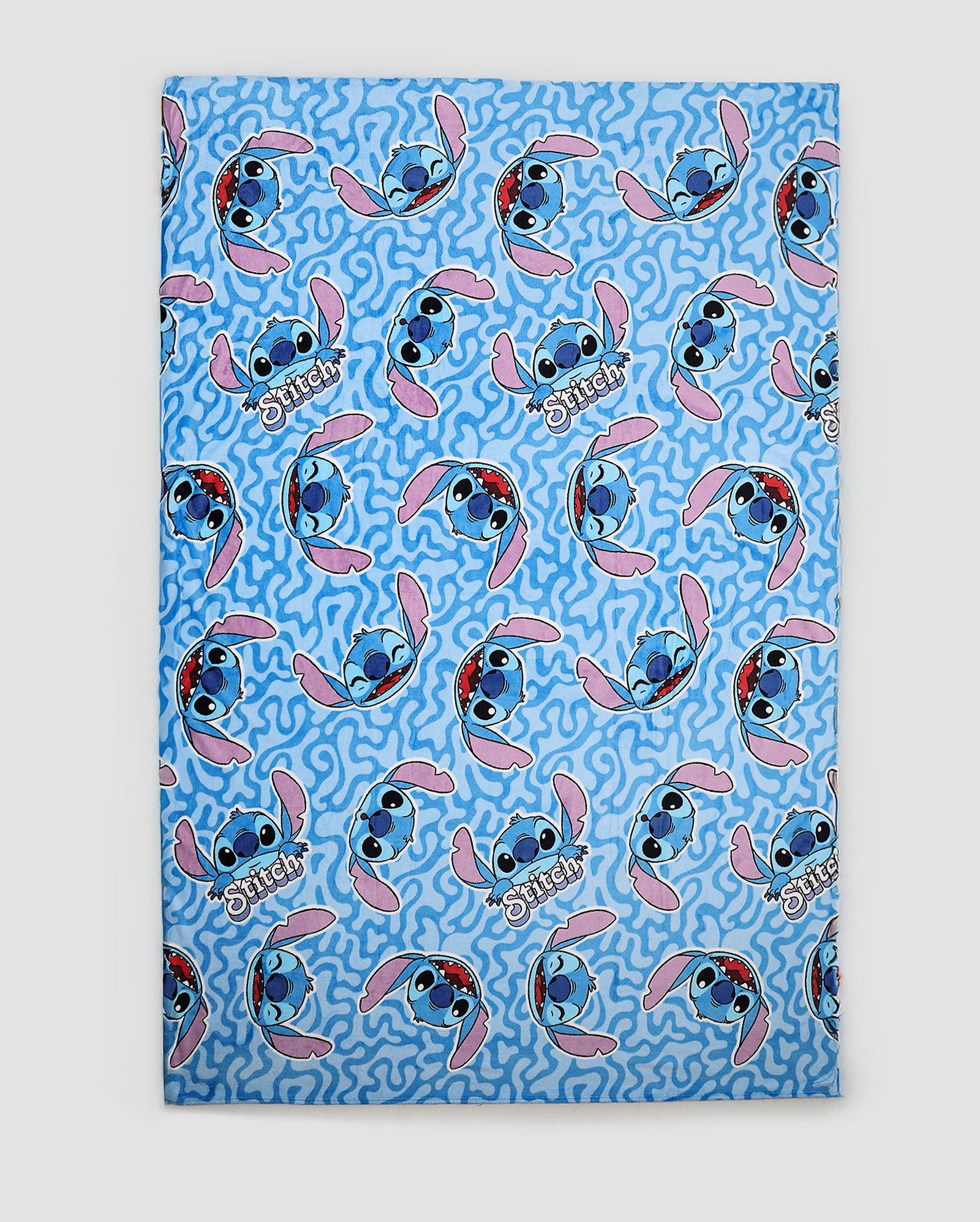 Manta solteiro flannel microfibra caretas Stitch azul | Casa Riachuelo