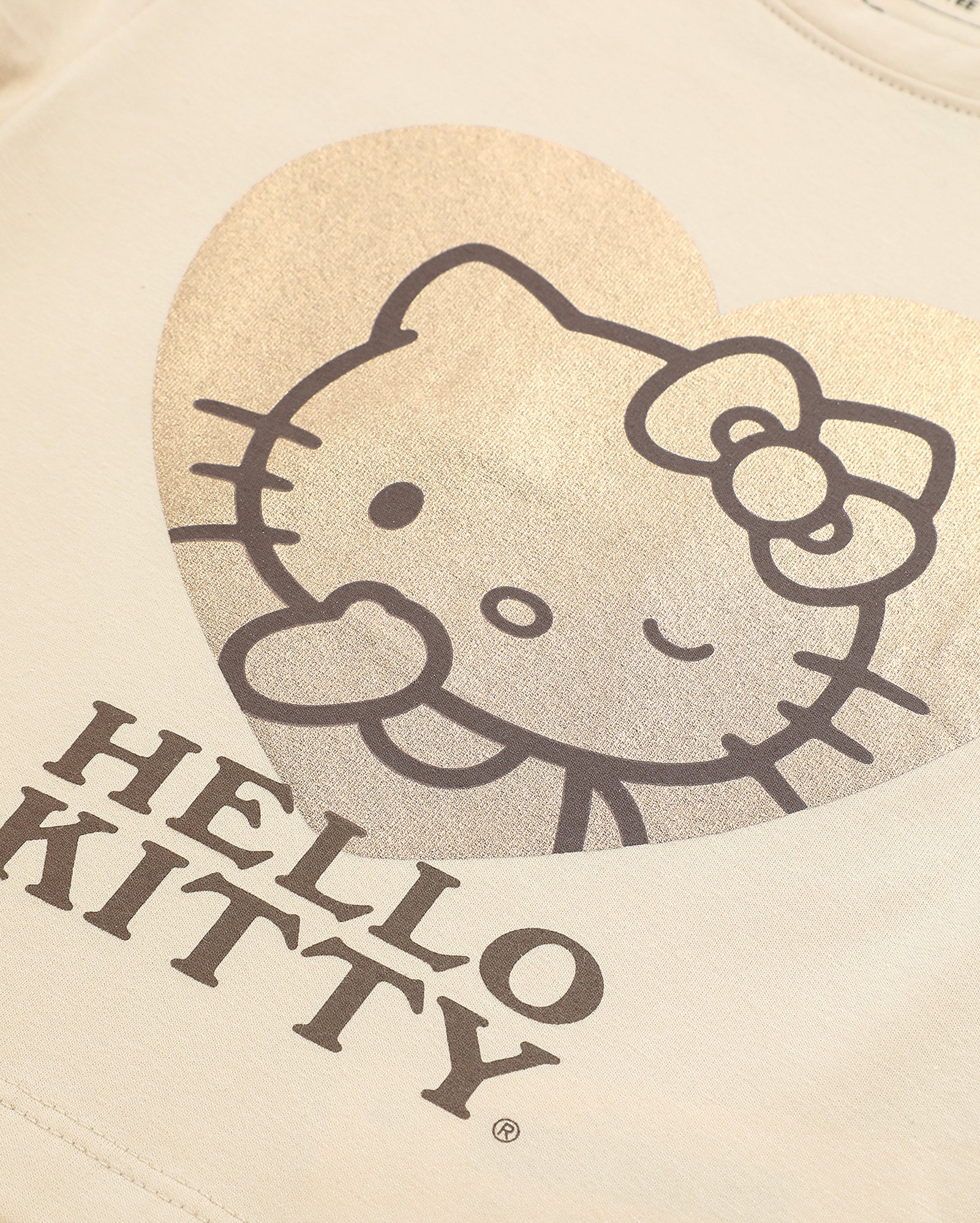 Camiseta juvenil baby tee Hello Kitty metalizada bege | Sanrio