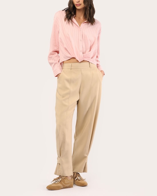 Calça feminina barrel com detalhe na barra - bege
